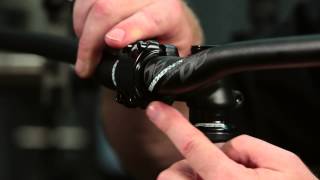 How To Remove And Install A Mountain Bike Handlebar By Performance Bicycle [upl. by Arreic107]