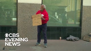 Homeless man helps hand out 100 bills to strangers [upl. by Durman]