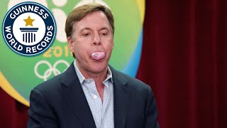 Bob Costas attempts largest bubblegum bubble world record [upl. by Ellirpa572]