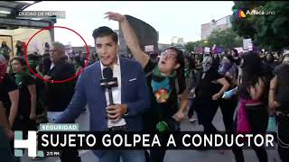 Provocadores golpean a reporteros en marcha contra violencia de género [upl. by Rairb449]